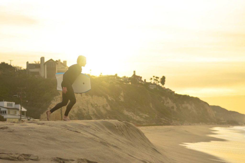 Image of man running on the beach