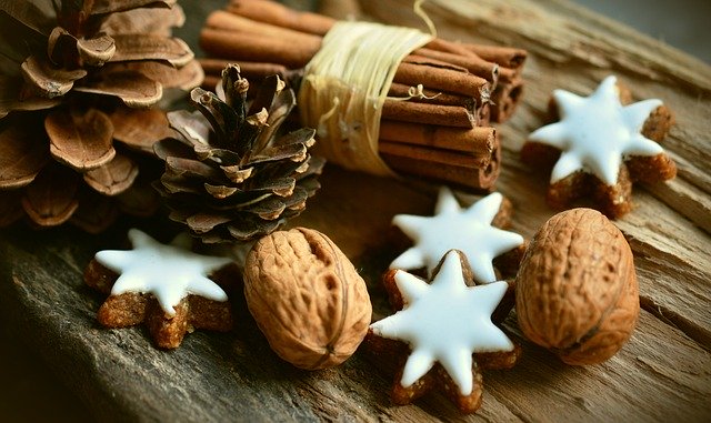 Some home-made cookies, cinnamon sticks and walnuts to portrayone of the decorating tips for the upcoming holiday season - DIY