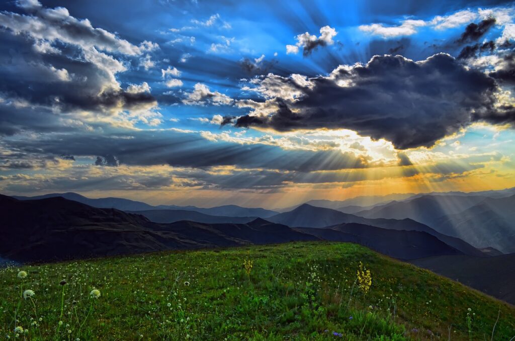 Clouds and sunshine above a valley.