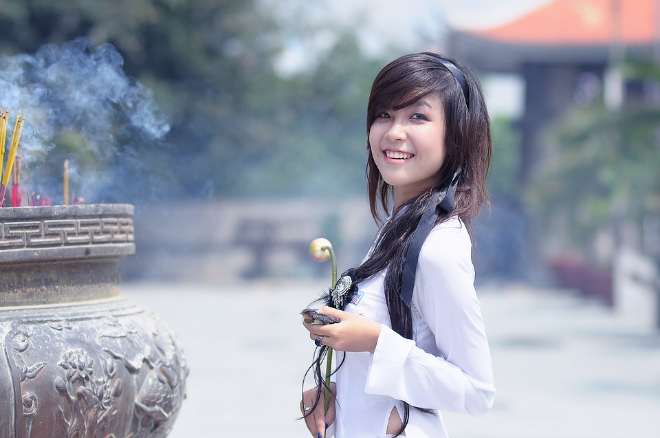 girl smiling with flowers