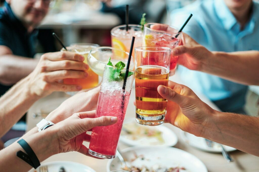 People drinking cocktails at a party.