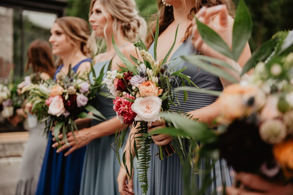 blue dresses bridesmaids flowers wedding