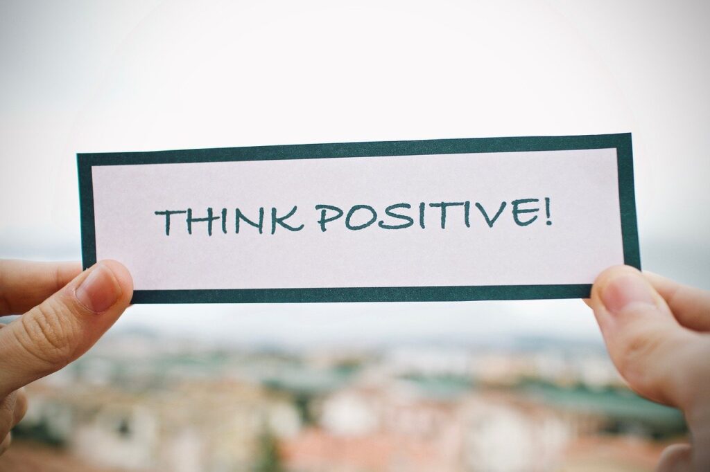 "Think Positive!" Written on a piece of paper.