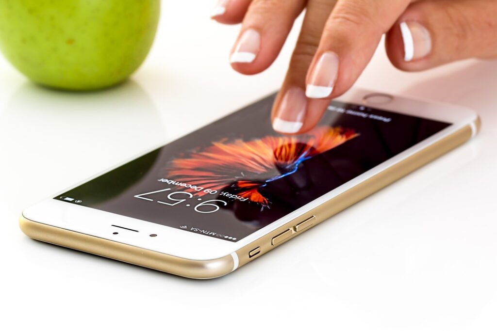 woman finger on mobile iphone 