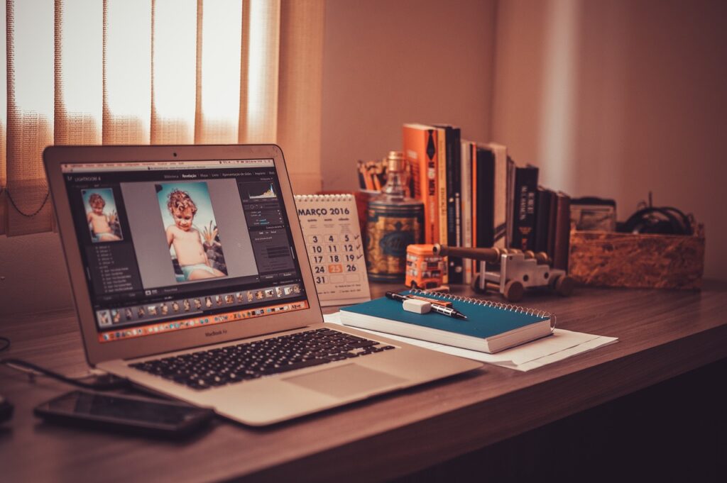 A home office desk with unnecessary items on it like books and toys.