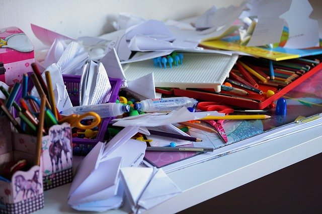 A desk with plenty of clutter on it could represent your next challenge as part of your summer decluttering projects.