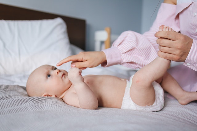 Mother playing with baby