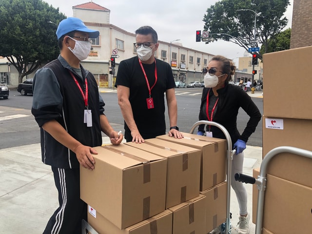 a moving team wearing masks during the pandemic