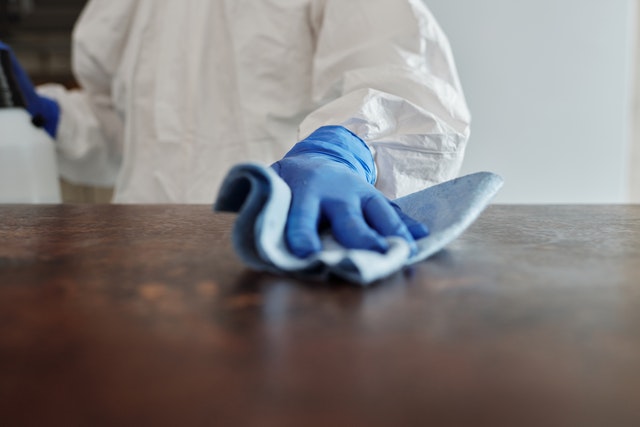 a person cleaning a desk