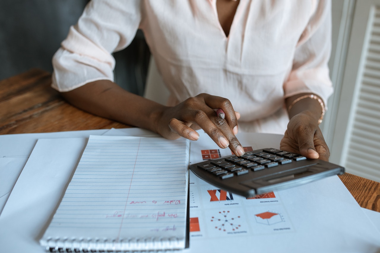 woman with calculator finances