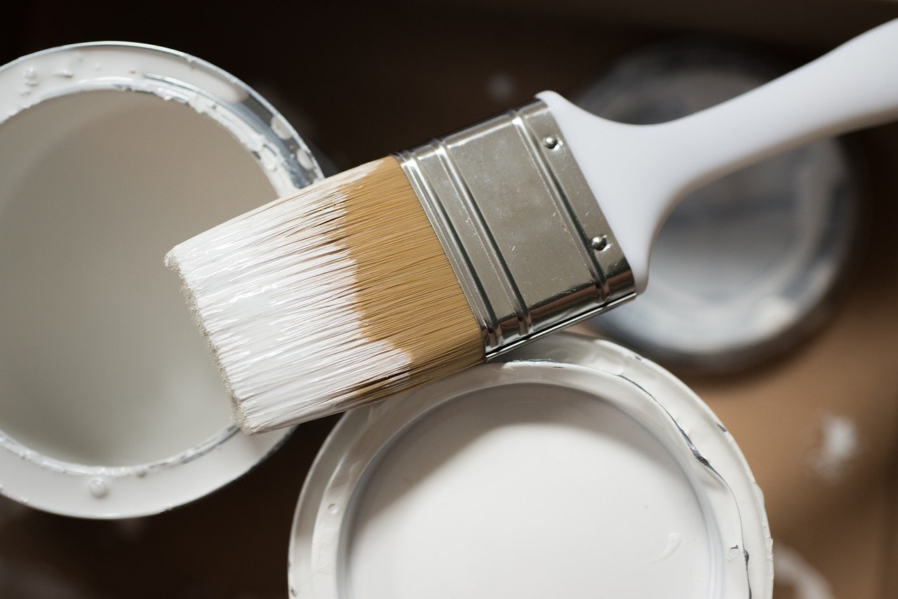 white paint and brush renovations