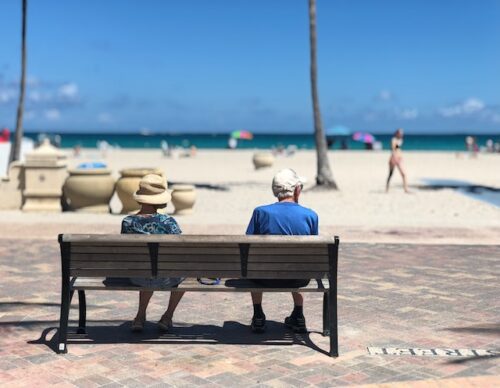 seniors sitting by the beach