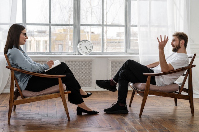 two people talking about the time to seek therapy