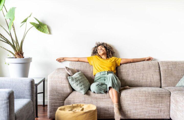 woman couch happy
