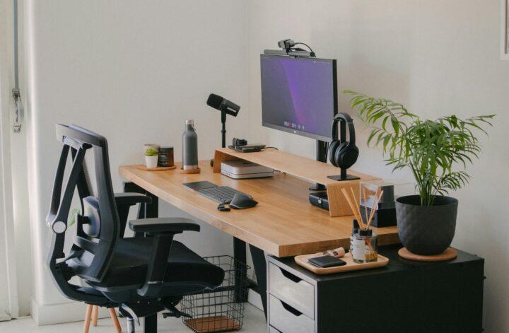 Modern minimalist home office with a computer workstation supporting a paperless lifestyle for sustainable and organized living.