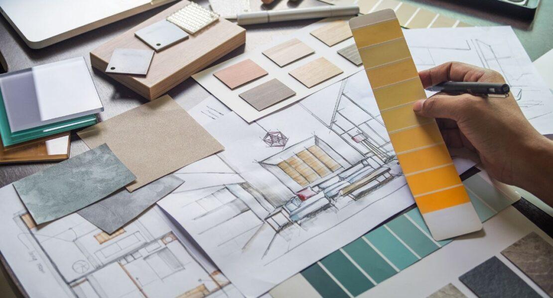 Interior designer reviewing color swatches and material samples for home updates that add lasting appeal.
