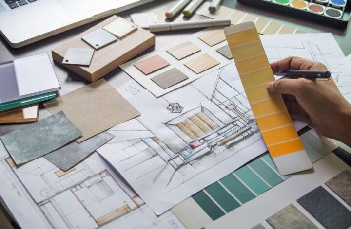 Interior designer reviewing color swatches and material samples for home updates that add lasting appeal.
