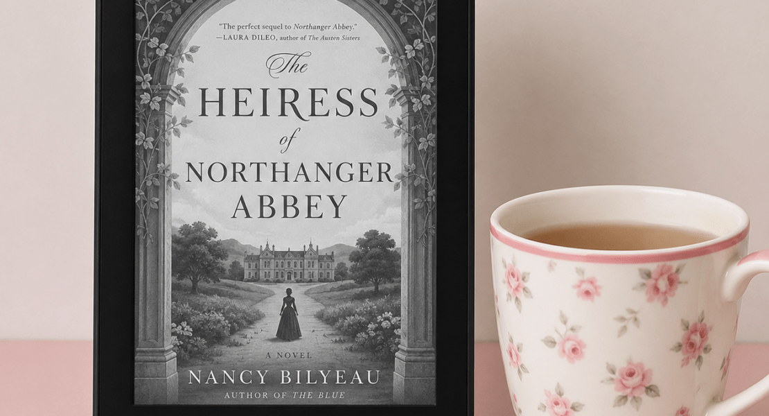 Kindle displaying The Heiress of Northanger Abbey by Nancy Bilyeau beside a floral teacup on a pink tabletop.