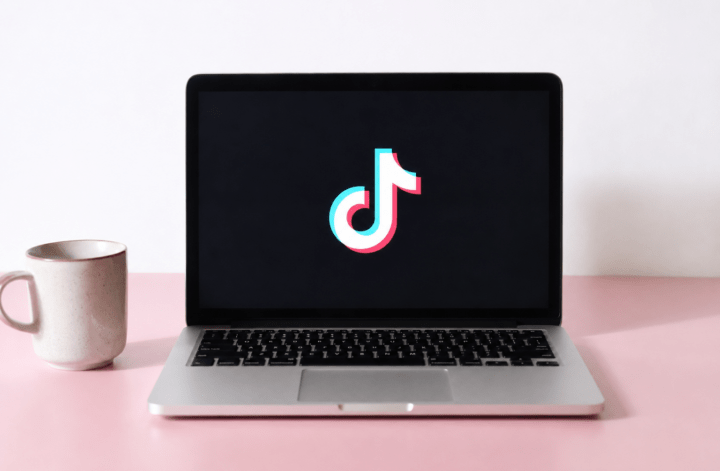 Laptop displaying the TikTok logo on screen, illustrating TikTok AI content policy updates that prioritize human creators.